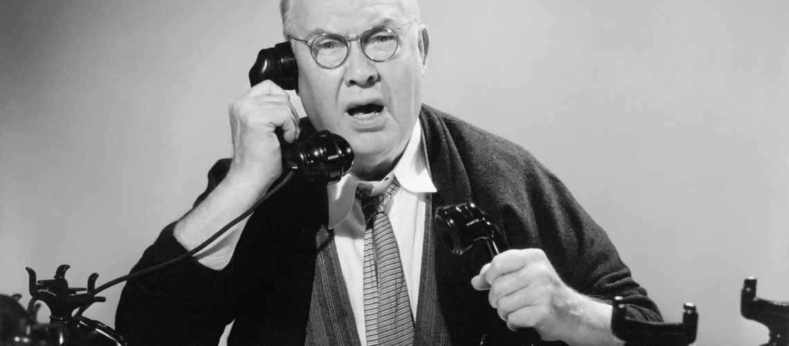 OLD MAN FRUSTRATED ON PHONE