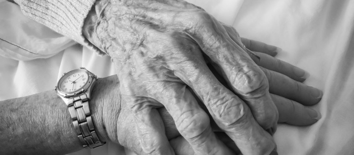 Horizontal,Black,And,White,Image,Of,An,Elderly,Woman's,Hand