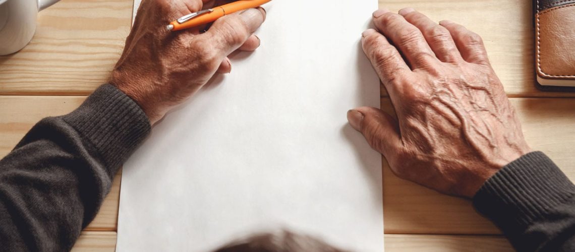The,Old,Man,Wrote,A,Testament,,Sitting,At,A,Wooden